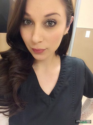 Selfie made by a sexy nurse in the hospital with her work outfit