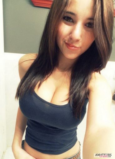 selfie of busty petite in tight shirt