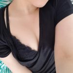 College girl selfie in her black shirt and bra showing a little bit of skin