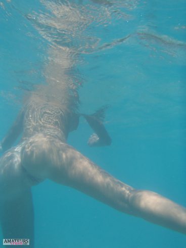 Beautiful underwater pussy and ass of swimming nude wife
