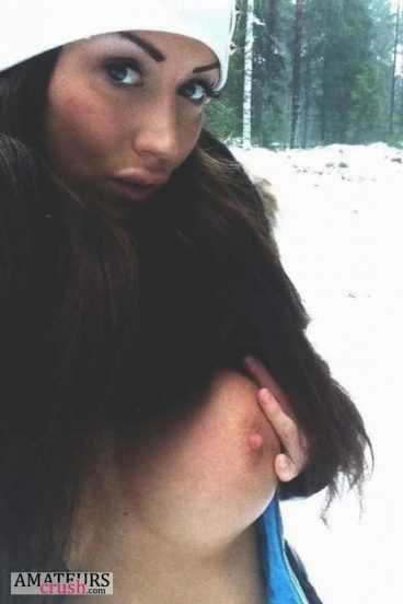 Outdoor winter selfie of girl flashing her beautiful boob