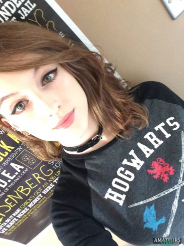 Sexy 19 year old teen making selfie with her Hogwarts shirt