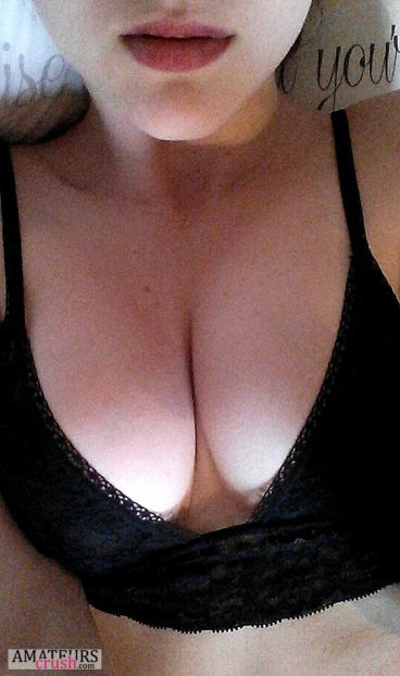 Sexy cleavage selfie in black bra with sexy lips