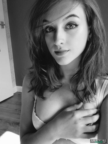 Grey and white photo of sexy slutty teen in bra