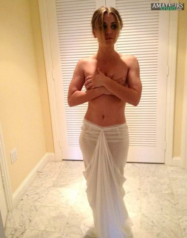 Topless Cuoco leaks covering her tits