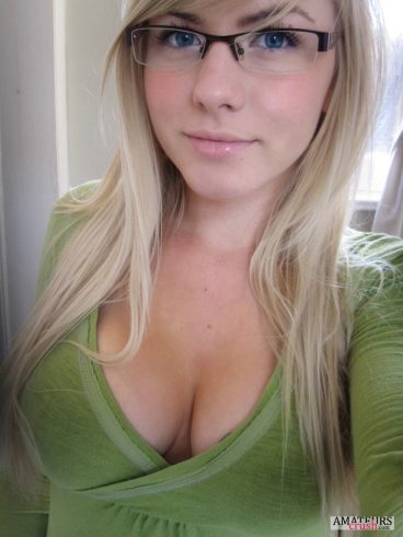 Beautiful blonde babe in green shirt in cleavage selfie