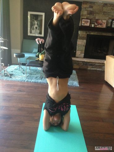 Doing yoga on her head 