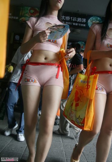 Sexy Asian camel toe of flyer girl on the street in her pink tight shorts