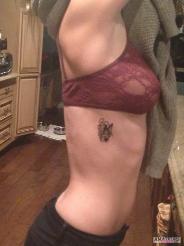 Showing off her small tattoo on her body