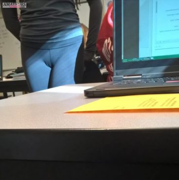 Young cameltoe in blue leggings of teen in her classroom