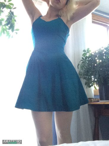 Sexy girl in her blue dress pantiless showing off