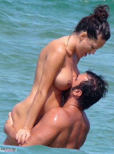 Man motorboating his big juicy girlfriends tits in the waters