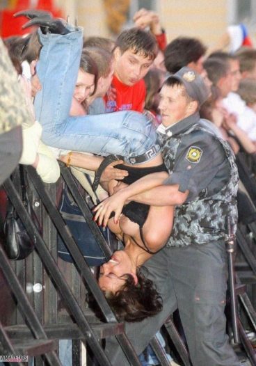 Tits exposed at a rally of hot busty brunette