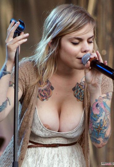 Big nipple slip oops of busty singer with her sexy tattoo and big cleavage