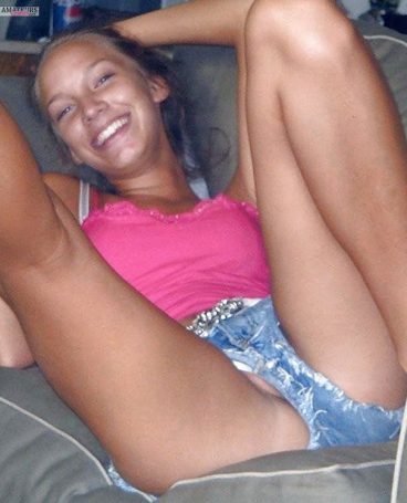 Teen pussy lip slip pic on couch with legs in air