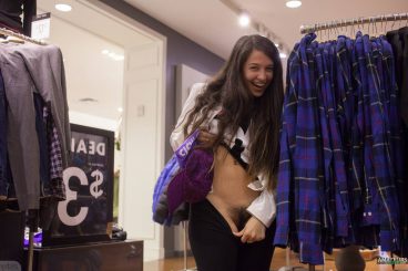 Hot college girl flashing her hairy pussy in clothing store