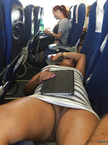 Exposed pussy of sexy girlfriend with no panties on airplane