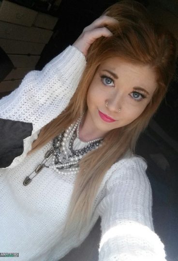 Natural real hot red head in her white sweater