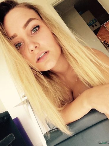Teasing amateur blonde showing a little cleavage