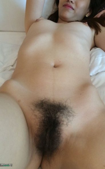 Mature Chinese wife with very hairy bush on bed