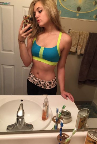 Sexy amateur blonde in her hot sporty outfit selfie