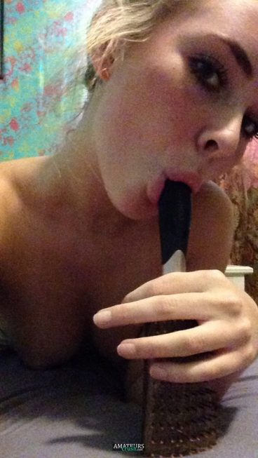 Horny teen sucking on her brush totally naked